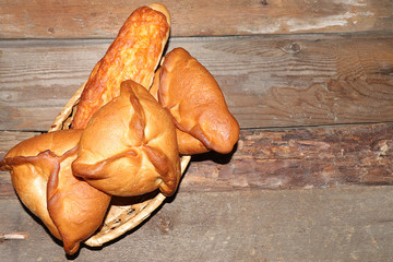 Homemade Russian pies with filling on an old wooden table, top view, place for a recipe. Traditional rustic style, © Светлана Балынь