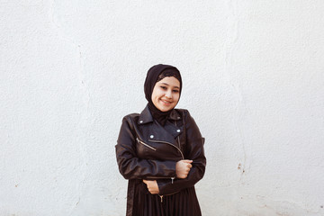 Portrait of beautiful middle-eastern girl in traditional Islamic clothing - hijab. Modern and young...
