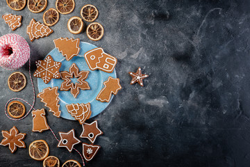 Various decorated gingerbread cookies on a plate
