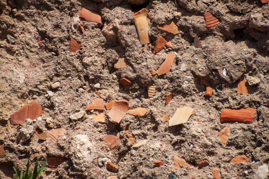 Potsherds are used to hold together the mortar of a structure in the archaeological park of Caesarea