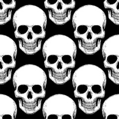 Seamless pattern with hand drawn skulls. Vector Illustration