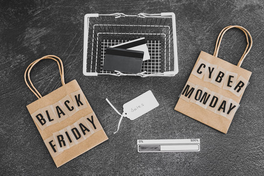 black friday and cyber monday shopping bags and basket with progress bar loading and payment cards