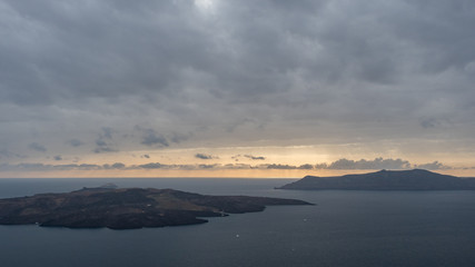 Fototapeta premium Santorini sunset cloudy sea island
