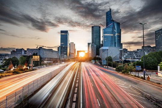 La Defense district skyline taken at the sunset with skyscraper and the rush hour traffic, Paris, France