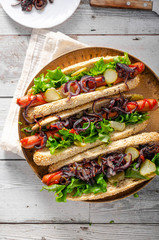 Hot dog with red onion