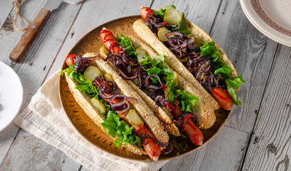 Hot dog with red onion