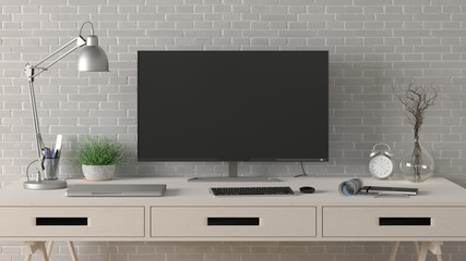 Desk with computer monitor. Workplace in the studio or at home with white brick wall. Clipping path around display. 3d illustration