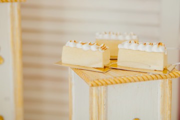 Desserts with fruits, mousse, biscuits. Different types of sweet pastries, small colorful sweet cakes, macaron, and other desserts in the sweet buffet. candy bar for birthday.