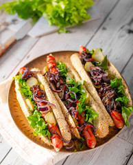 Hot dog with red onion