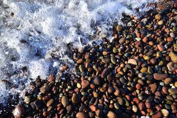Geology Colouful Pebbles, Stones, & Rock with Sea Foam