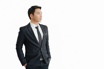 Obraz na płótnie Canvas young businessman Asian wear a black suit, and standing smart poses looking out into the future,Intelligent and confident people,Successful leader,Management,On a white background.