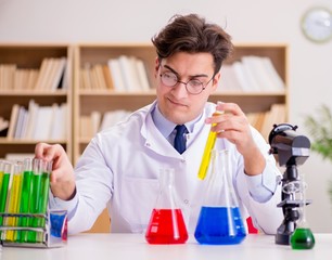 Mad crazy scientist doctor doing experiments in a laboratory