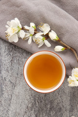 Fototapeta na wymiar cup of tea with jasmine flowers
