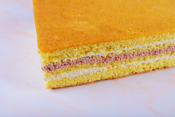 Layer sponge cake with cream cheese and blended sour cherry filling.