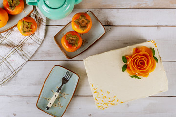 Creamy cake with wipped cream cheese and decorated with persimmon.