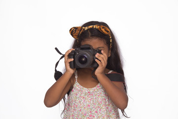 Beautiful girl using a digital camera isolated on white.