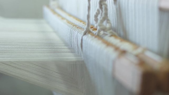 making traditional tapestry on a wooden weaving loom 4k