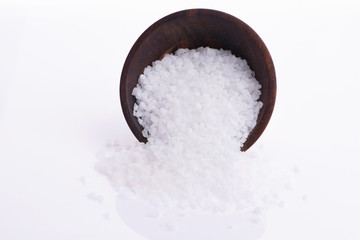 Salt in spoon with white background