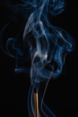 Match with blue smoke with black background