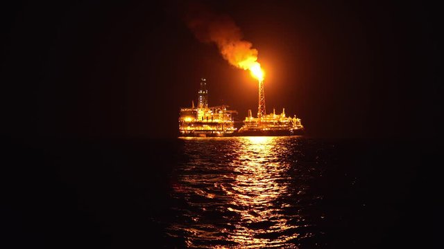 FPSO tanker vessel near Oil platform Rig. Offshore oil and gas industry, sea oil production and storage
