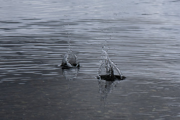 Rock splashes in the water