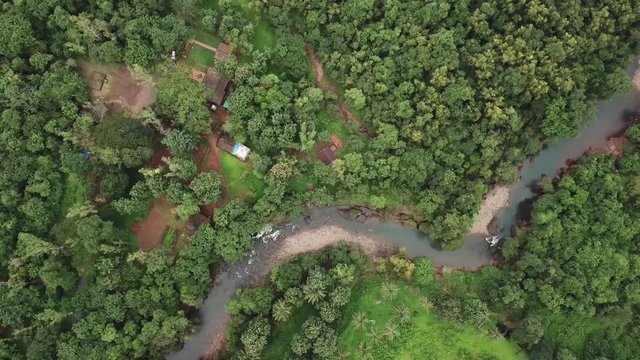 A drone shot flying over a river in Netravali wildlife reserve, Goa, India.