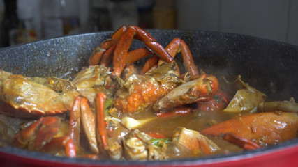 Chef cooking Chili Crab Singapore Chinese cuisine iconic dish
