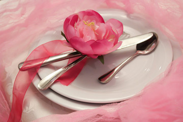 Gorgeous wedding chair and table setting for fine dining in rose and purple.