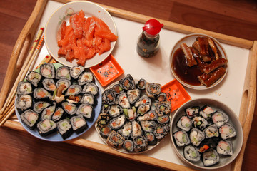 table with a set of rolls and sauce