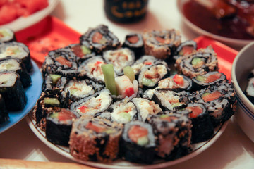 table with a set of rolls and sauce