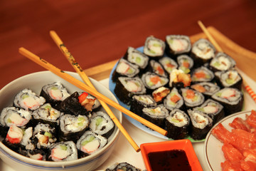 table with a set of rolls and sauce