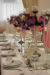Gorgeous wedding chair and table setting for fine dining in rose and purple.
