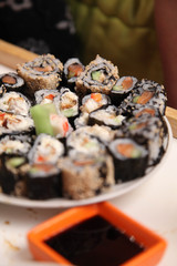 table with a set of rolls and sauce