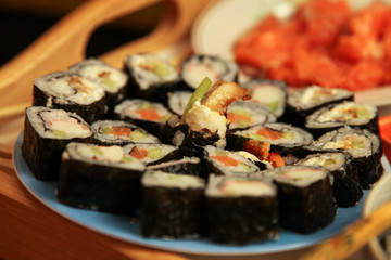 table with a set of rolls and sauce