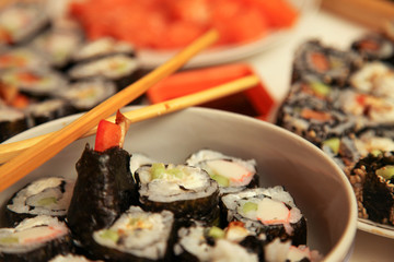 table with a set of rolls and sauce
