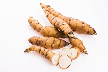 Raw Whole Jerusalem artichokes on a white background