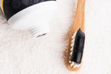 Toothbrush with black charcoal toothpaste