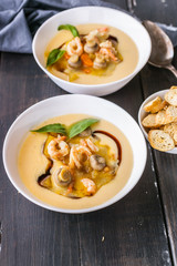 Two spoon of vegetables soup made of prawns and mushrooms. Healthy and Low-Calorie Seafood Recipes. Vertical shot