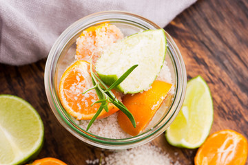 Preserved Lime and Mandarin with salt on a wooden board