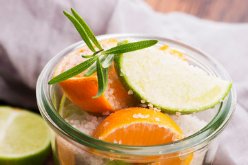 Preserved Lime and Mandarin with salt on a wooden board