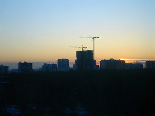 construction crane at dawn in the city