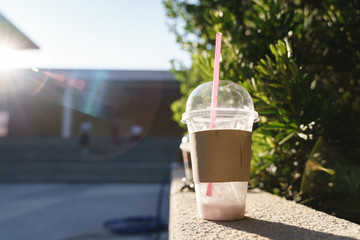 Drinking plastic cup with disposable straw