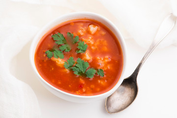 Tomato soup with rice decorated with parsley