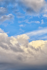 Gloomy beautiful blue sky with clouds in the evening.  Vertical photography