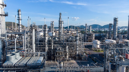 Aerial view of chemical oil refinery plant, power plant on blue sky background.