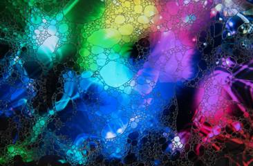 Mixing water and oil to form beautiful colorful abstract backgrounds 