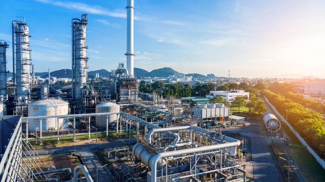 Aerial view of smart chemical oil refinery plant, power plant on blue sky background , Gas Oil depot, Crude Oil Refinery Plant Steel Pipe line and Chimney Cooling tower, Chemical or Petrochemical