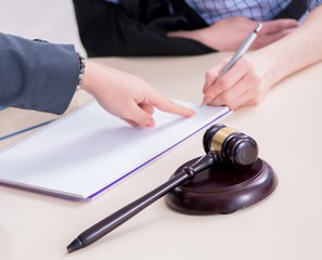 Injured employee visiting lawyer for advice on insurance