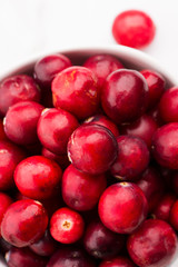 Ceramic bowl of Cranberry on white background