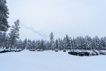 Fototapeta na wymiar Editorial: Kuusamon City, Finland, 27th December 2018. Car park at Holiday Club Kuusamon Tropiikki with heavy snow in winter season at Kuusamon, Finland.